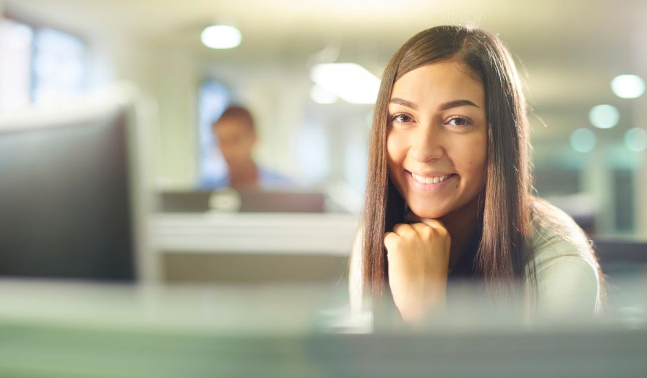 paralegal sitting at desk in law firm