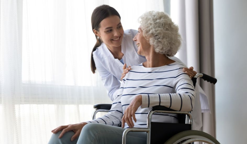 personal support worker helping senior in wheelchair