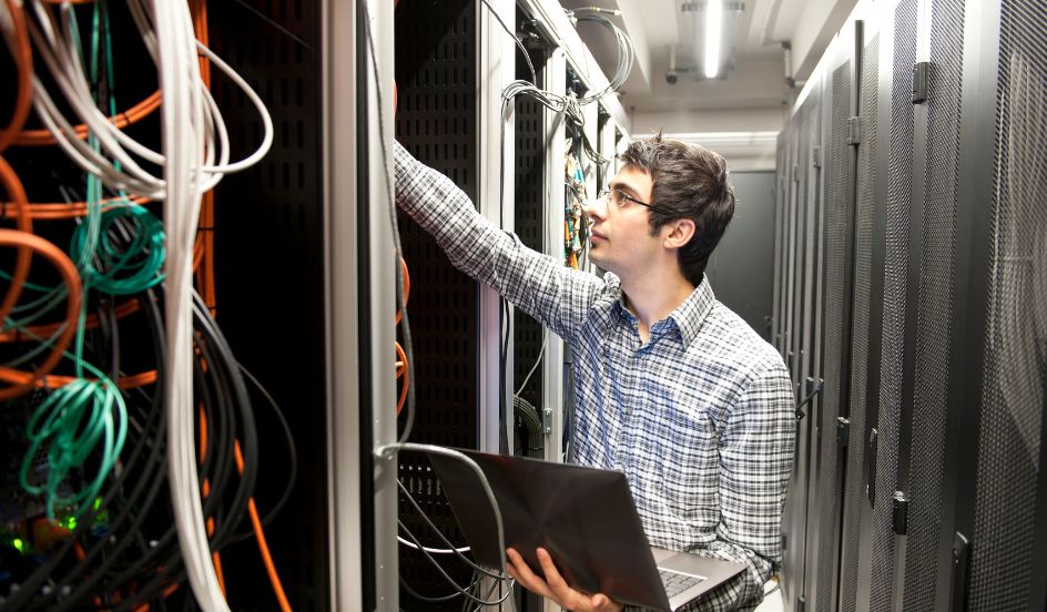 IT specialist working in server room