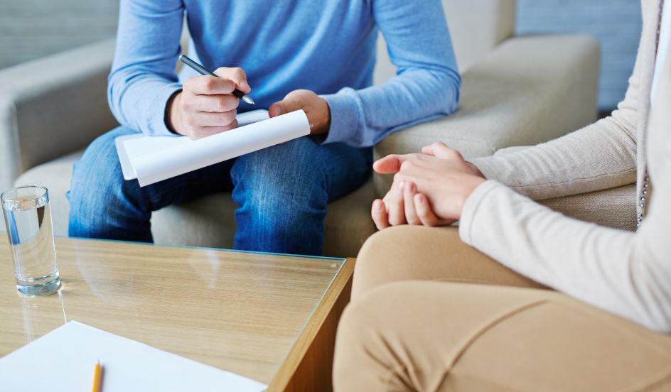 community service worker talking with client