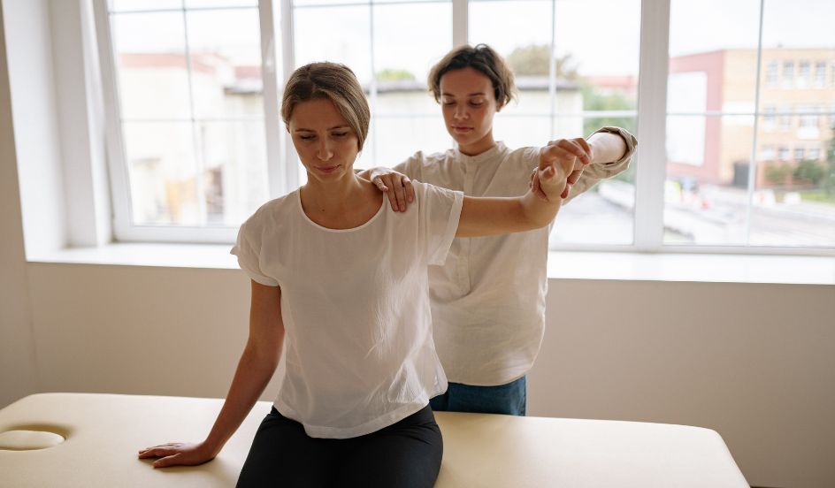 occupational therapist helping patient