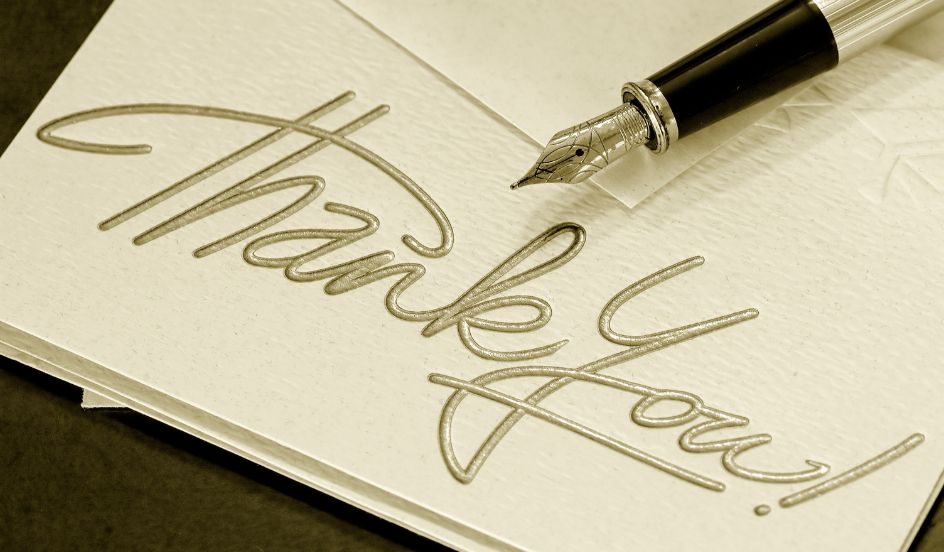 thank you note with a pen