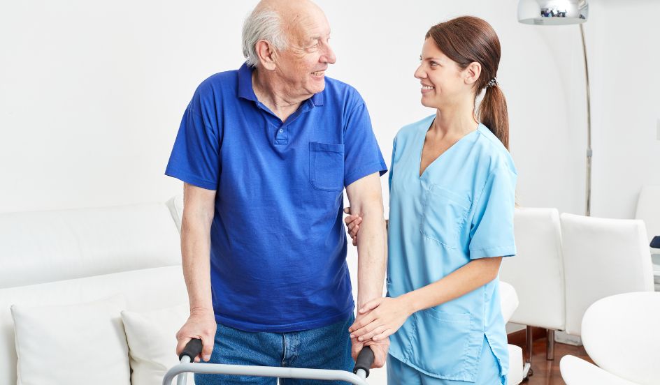 senior being helped with walker by occupational therapy assistant