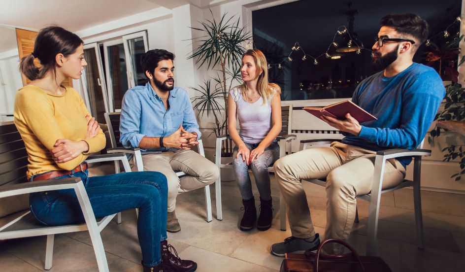 group of people sitting together with an addiction worker