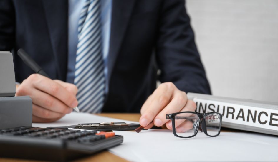 insurance professional sitting at desk