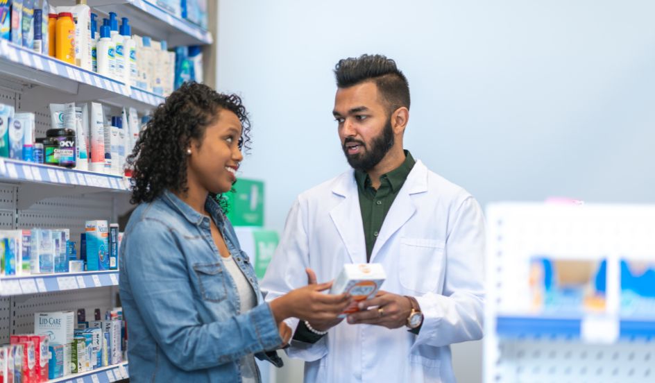 pharmacy assistant helping customer