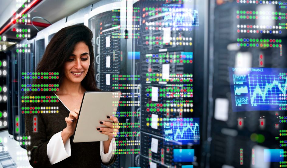woman holding tablet in server room