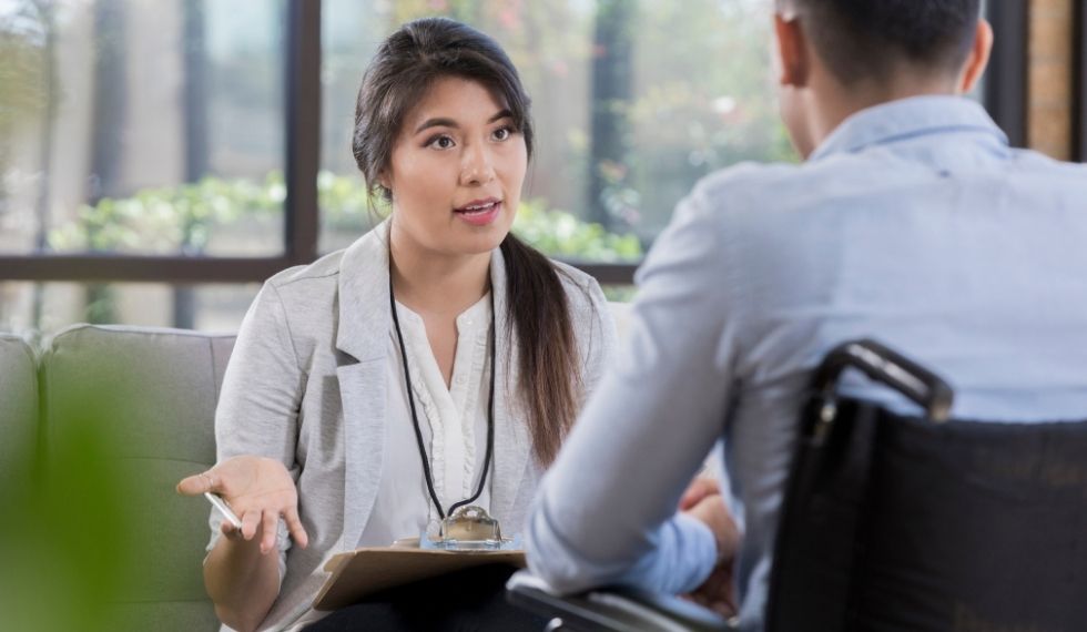 addiction worker speaking with a client