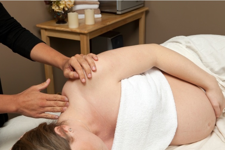 Woman getting a pregnancy massage