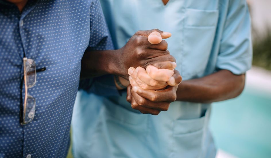 personal support worker helping patient