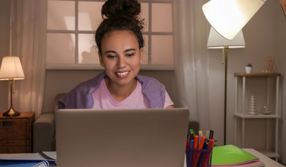 woman on laptop doing online learning at home